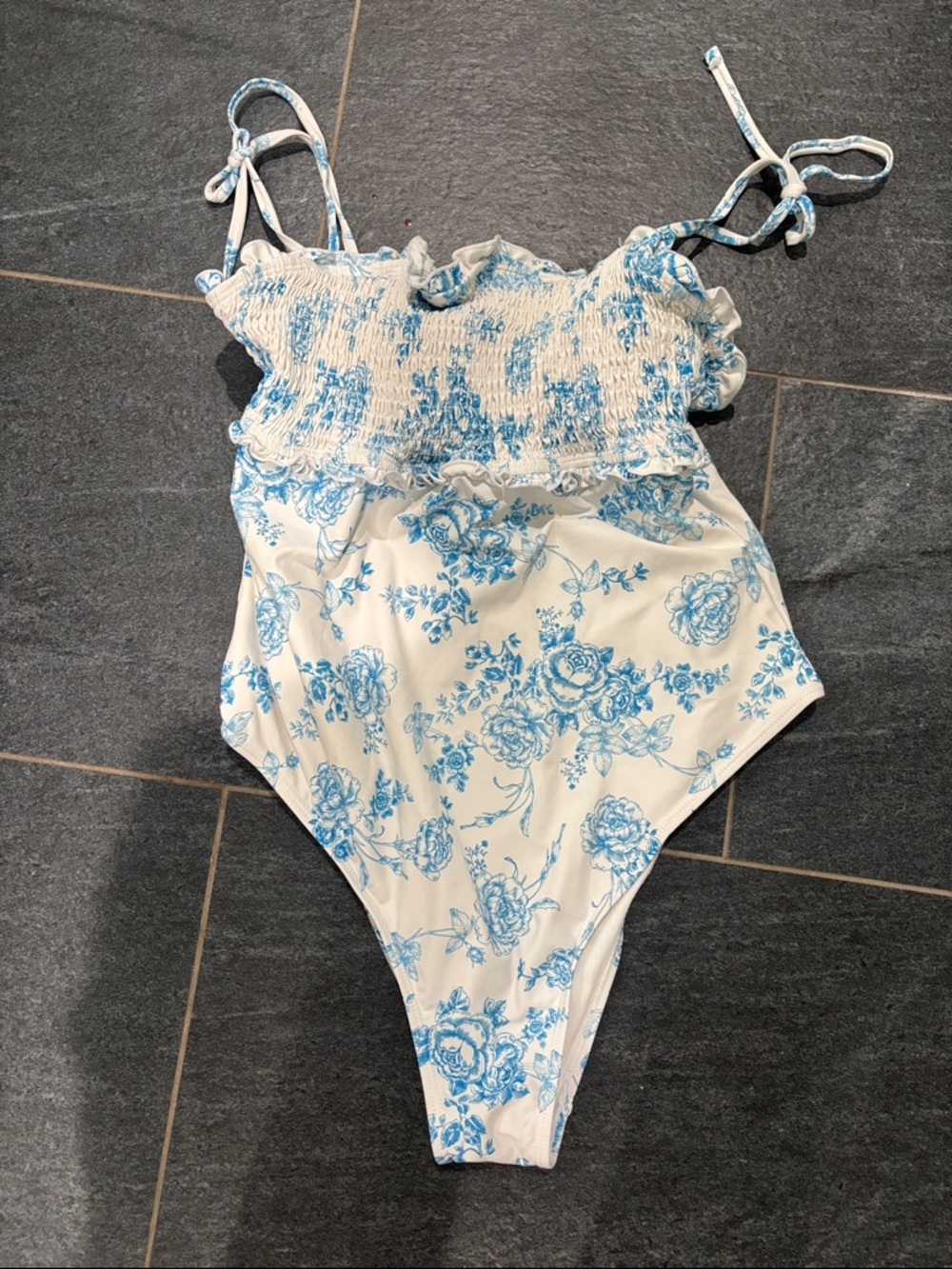 Celebrity Pink White One-Piece with Blue Floral Print